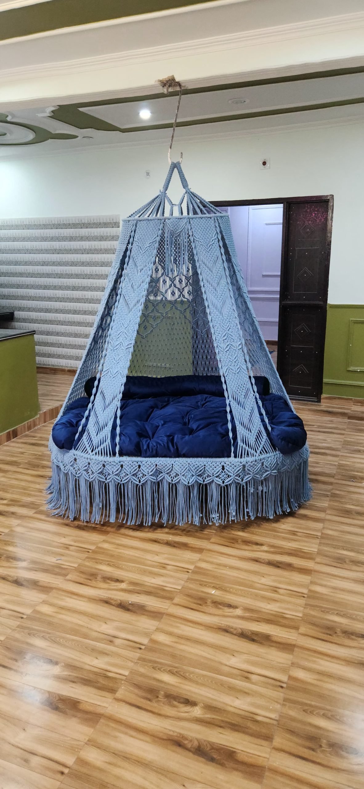 Blue macrame swing bed